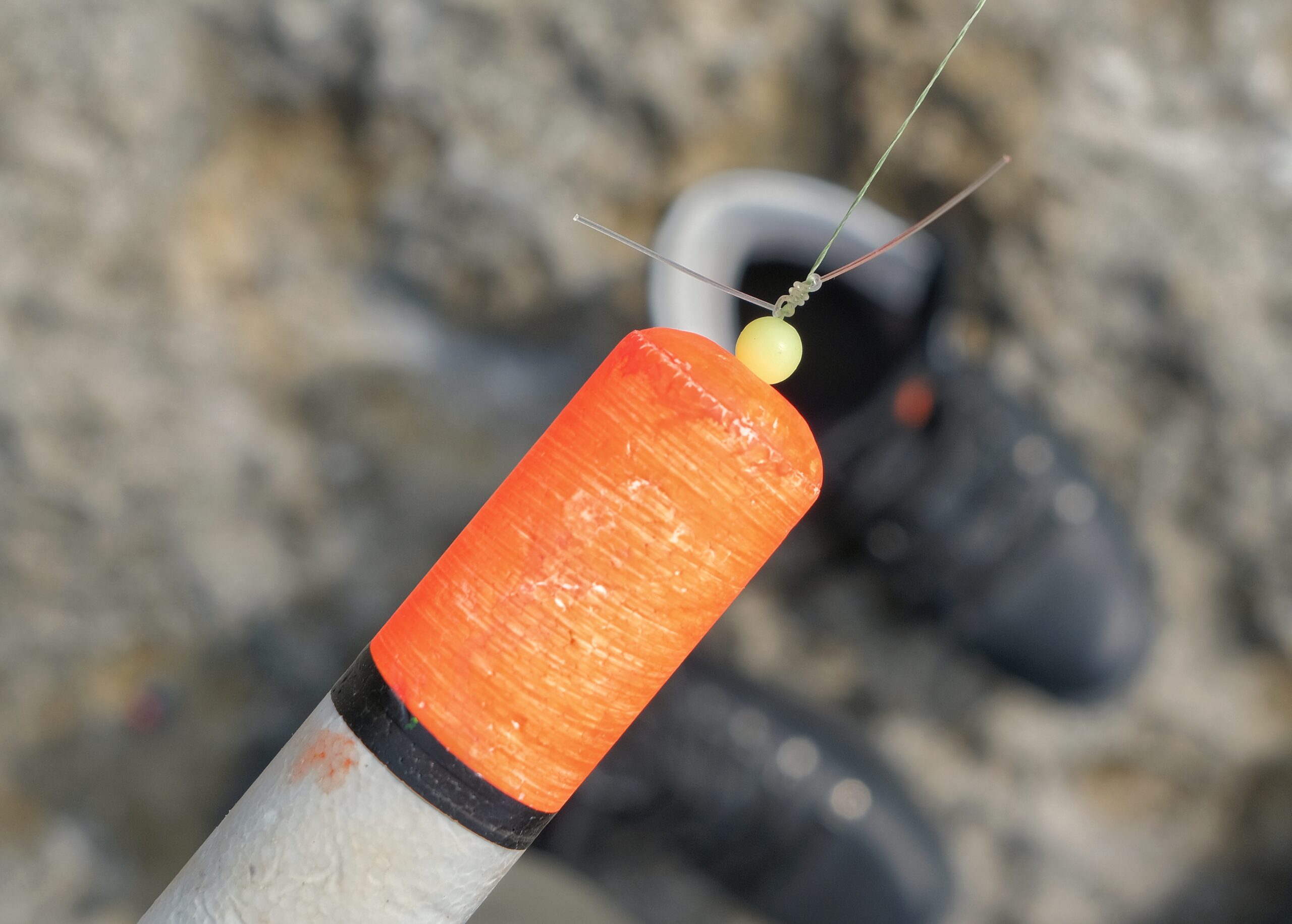 A stop not, tied above the float